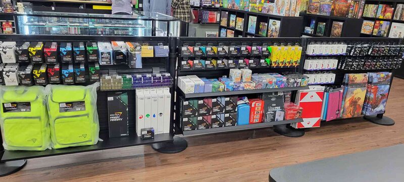 A wall of card sleeves, deck boxes and binders