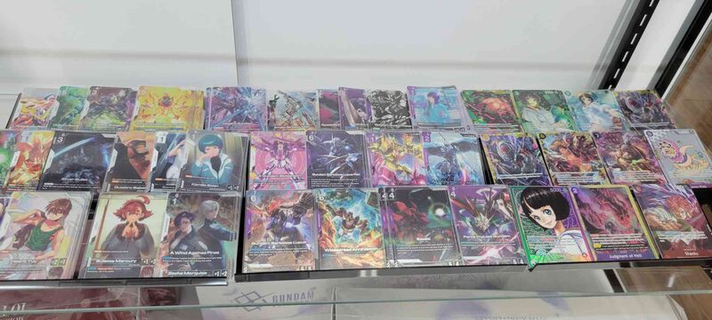 Trading card singles laid out in the display case